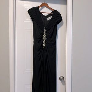 Beautiful long black evening dress with silver and gold stones, size 14.